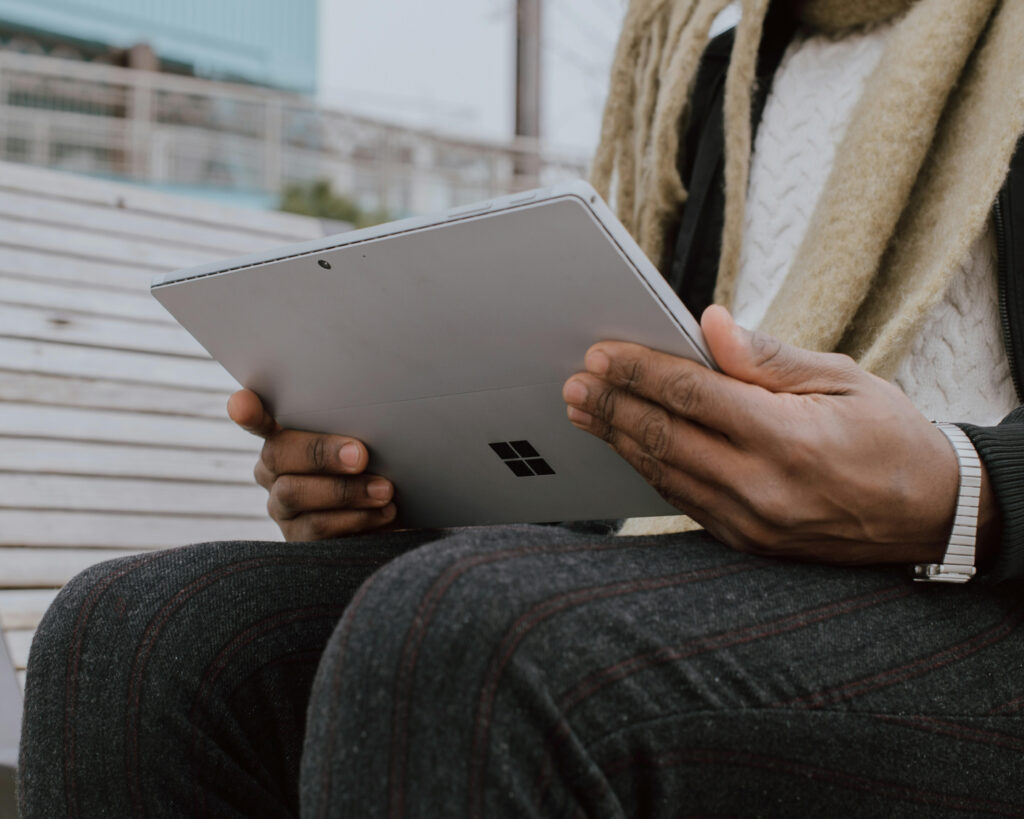 Person viewing laptop.